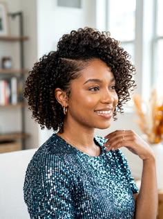 Natural twist-out with one side tucked behind the ear