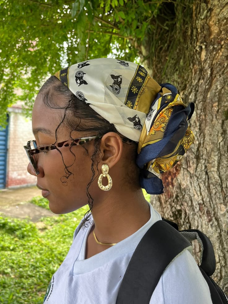 Natural hair styled with an elegant silk scarf