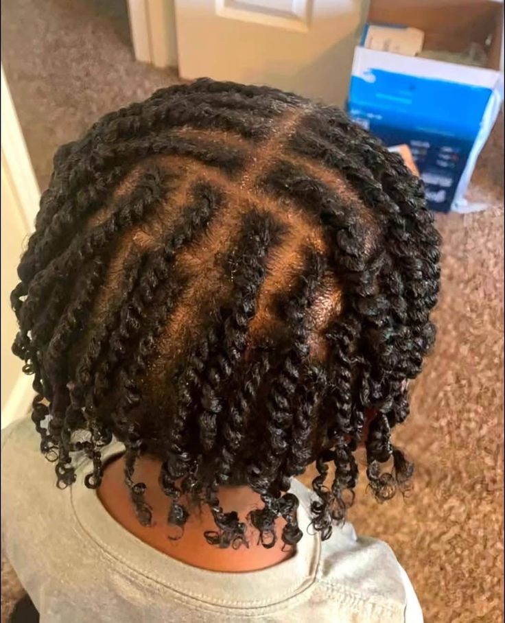 Child wearing a simple protective style after washing 4C hair