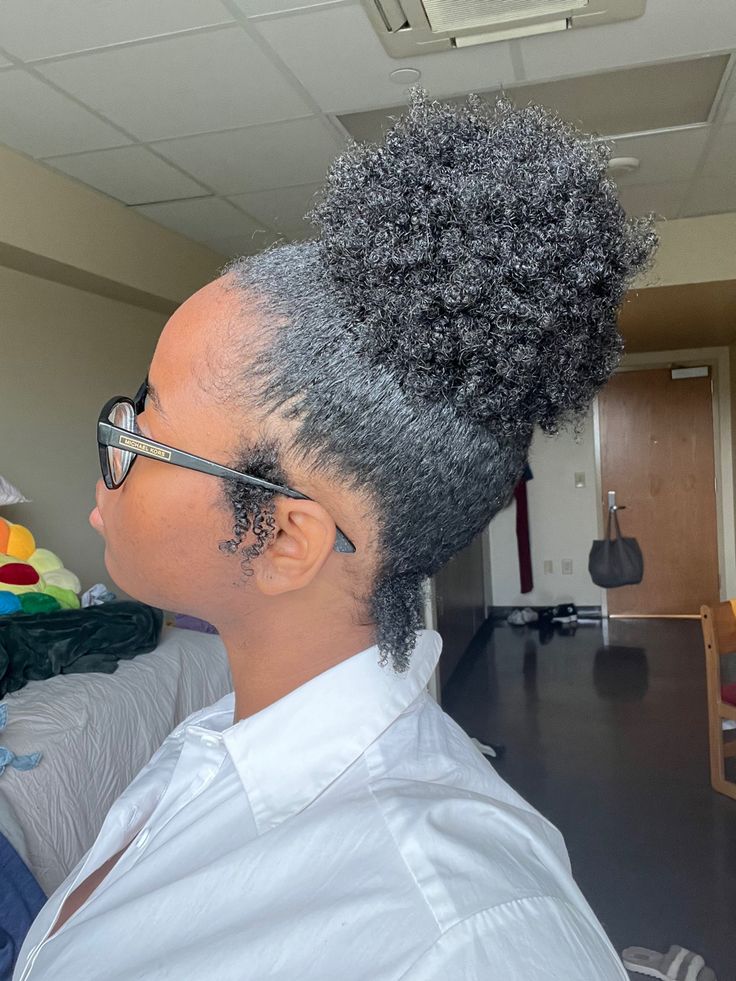 Small sleek puff hairstyle on natural 4C hair