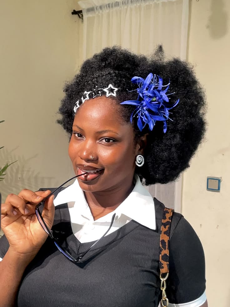 Woman wearing a statement hair accessory with natural hair