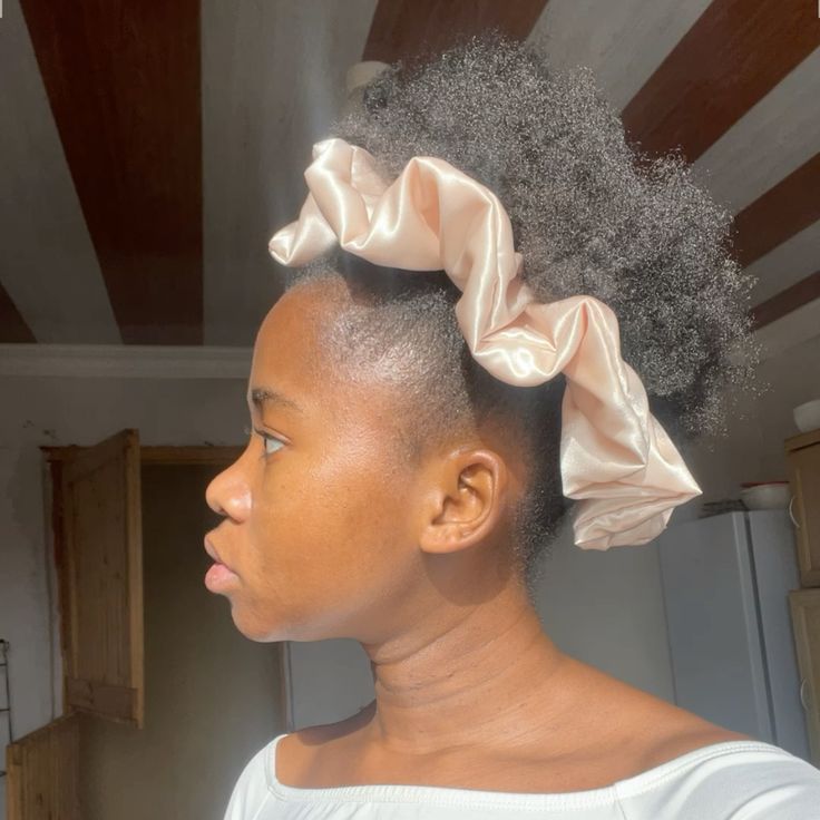 Natural 4C puff hairstyle with a statement scrunchie