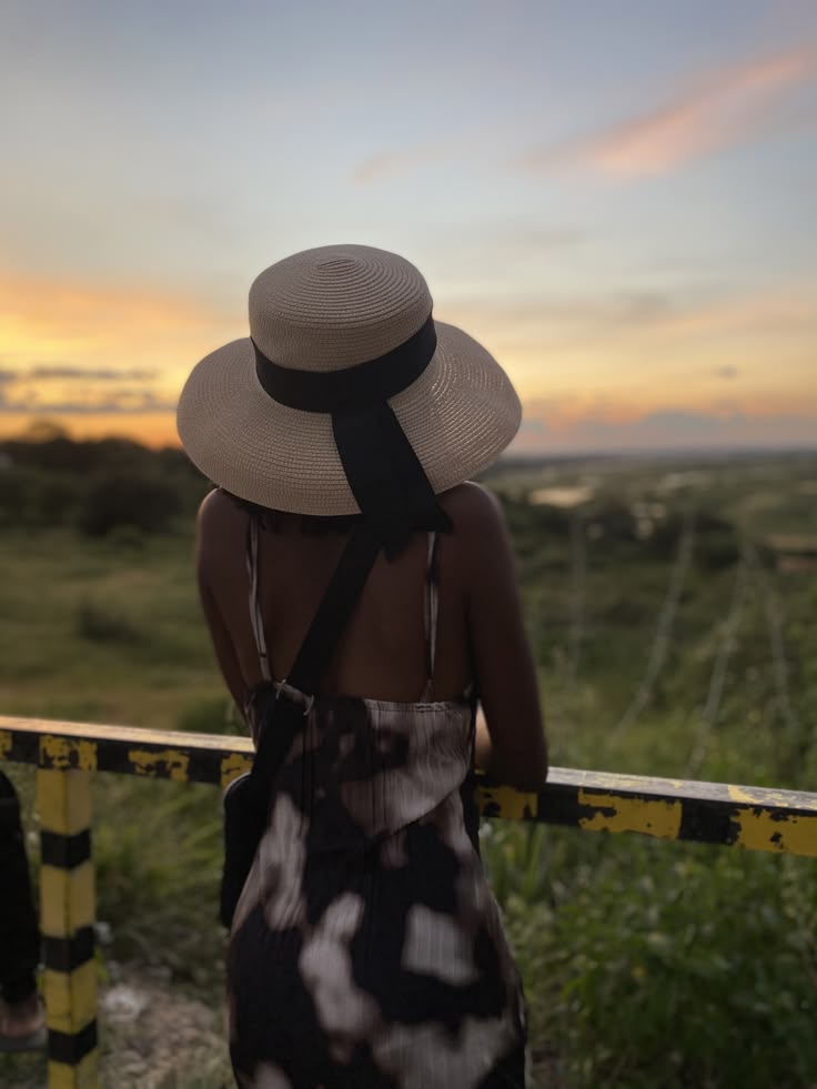 Woman protecting her natural 4C hair during outdoor summer activities