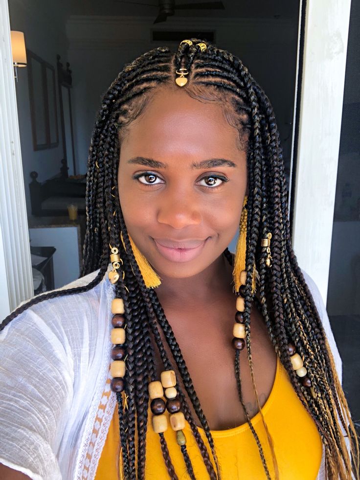 Woman with detailed tribal-inspired braids and natural hair