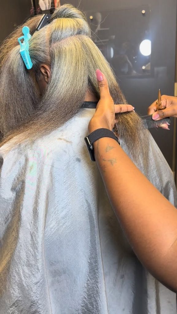 woman getting her colored hair trimmed