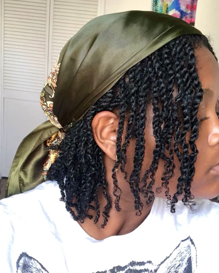 Woman wearing two-strand twists with a scarf