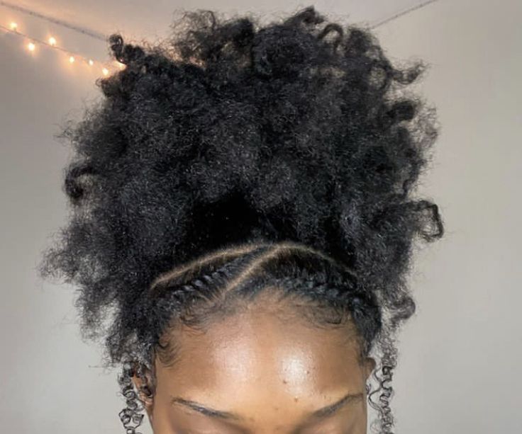 High puff hairstyle with two front braids on 4C hair