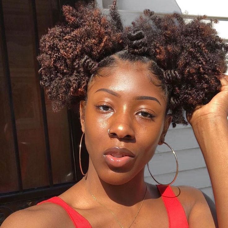 Natural 4C hairstyle with two puffs and Bantu knots