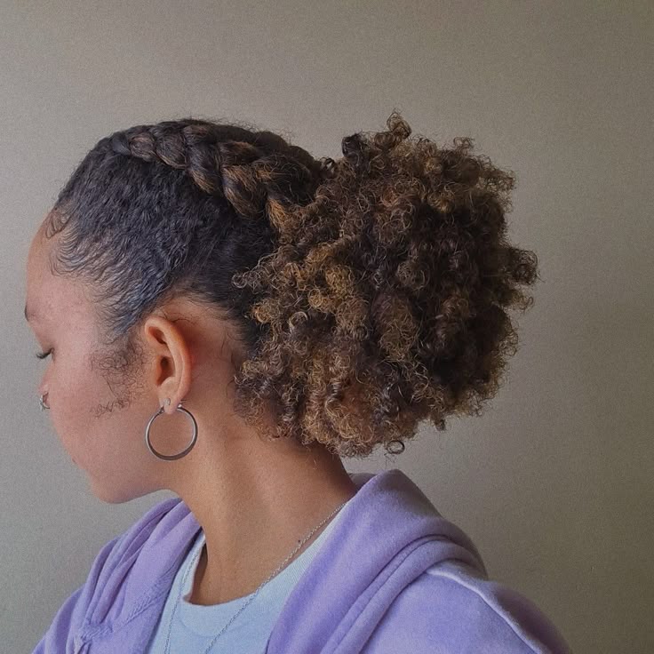 Natural 4C puff hairstyle with two side braids