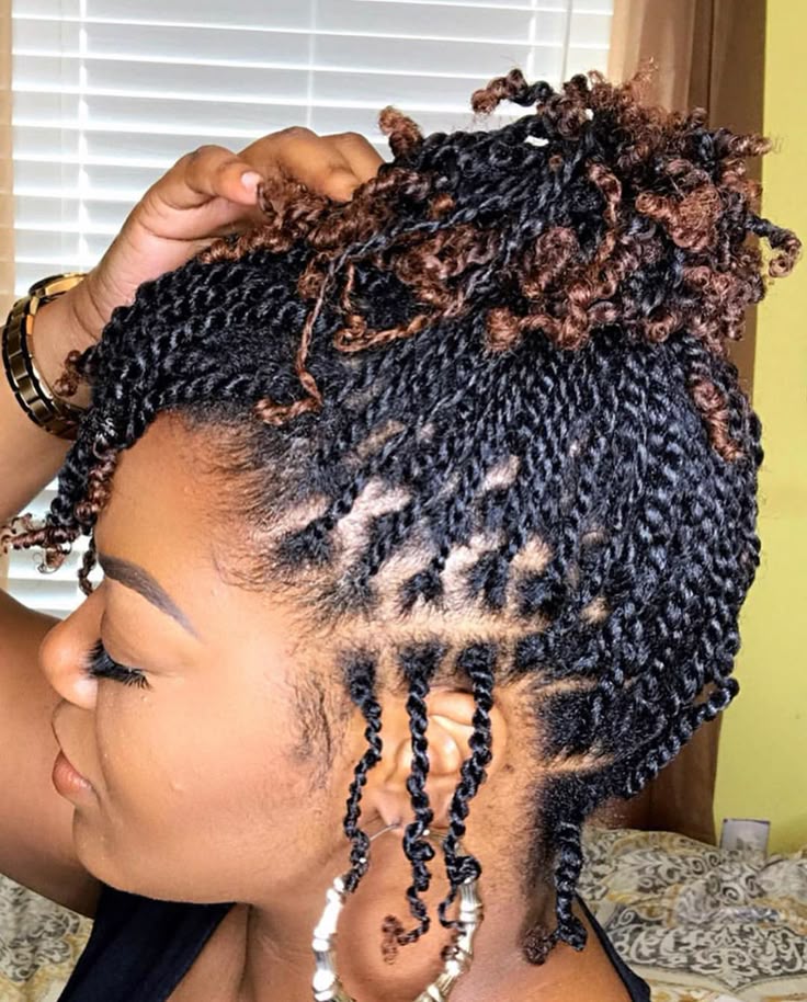 Natural hair styled in a two-strand twist updo for rainy day