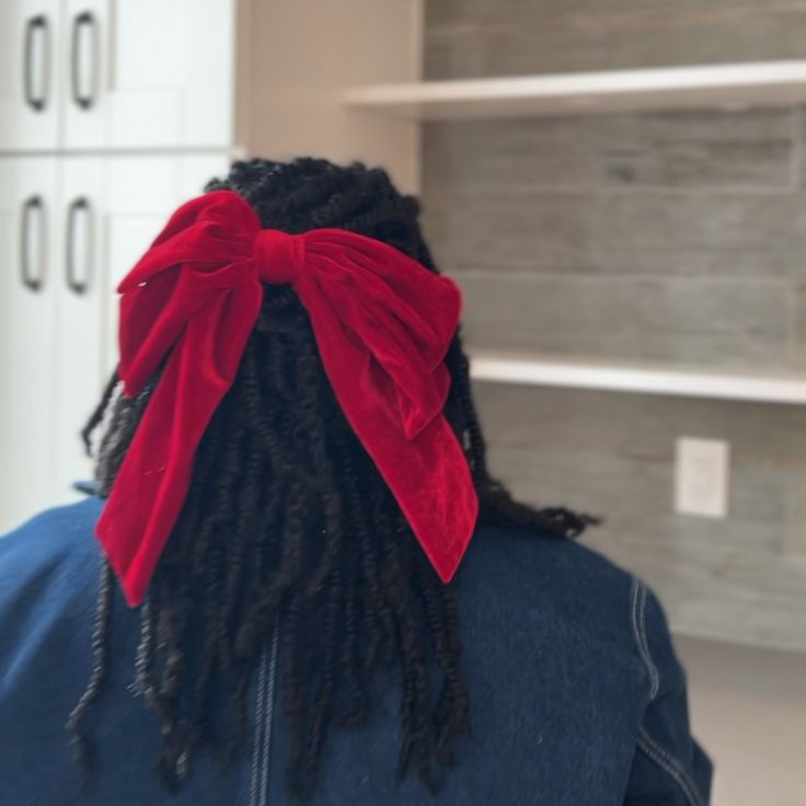 Natural hair styled with a velvet bow