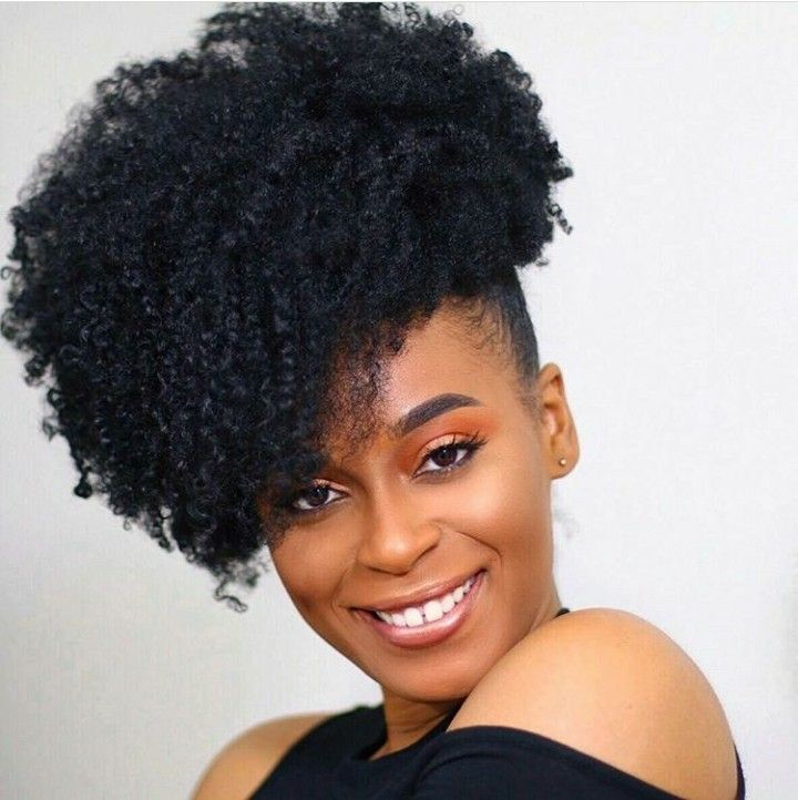 Large voluminous side puff hairstyle on natural 4C hair