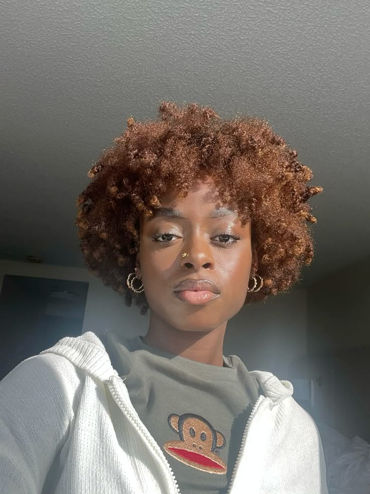 Black woman with warm caramel natural hair color for dark skin