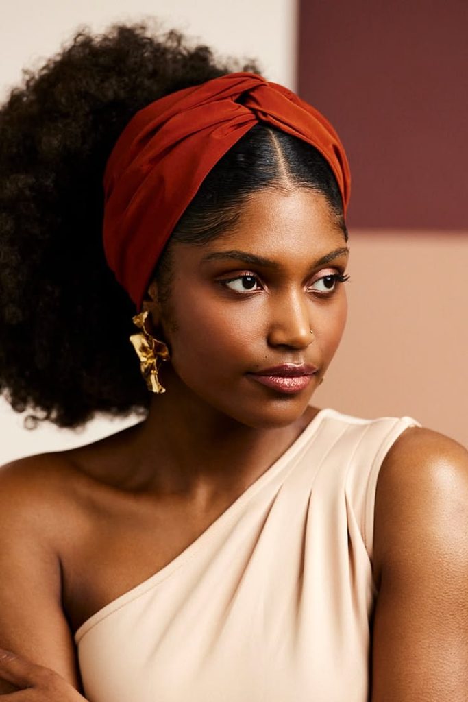Woman wearing a wide fabric headband with natural hair