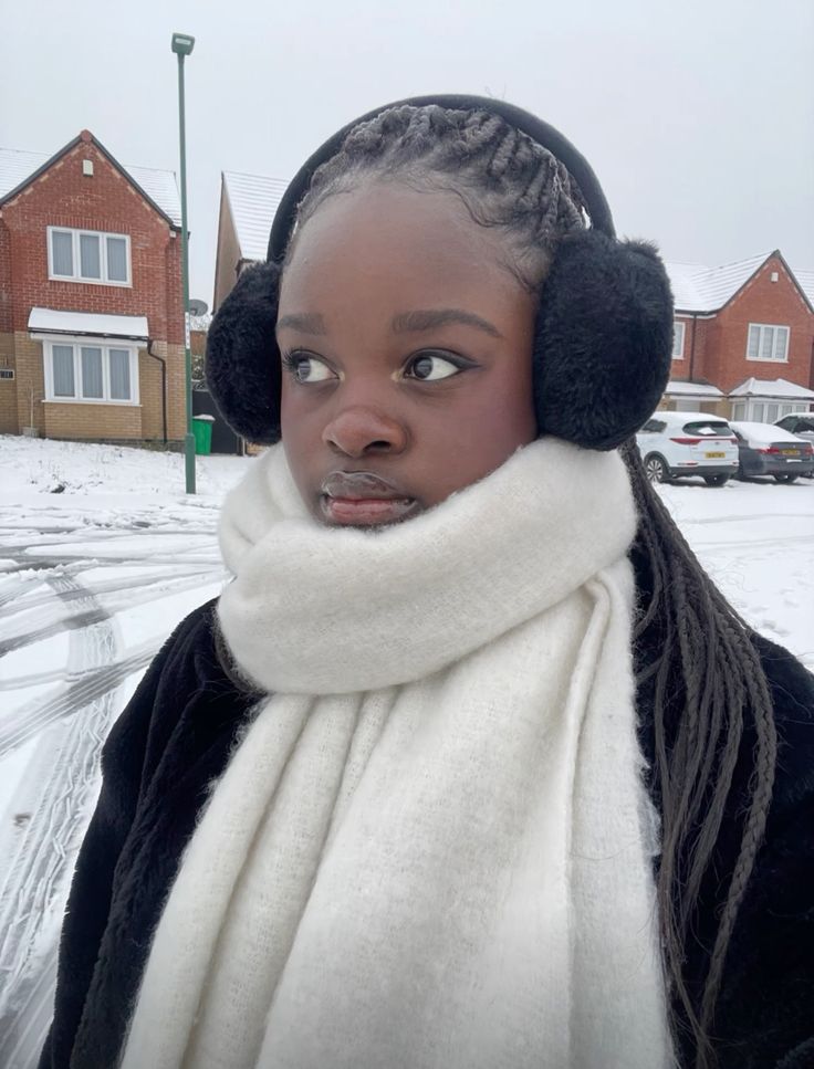 Woman wearing a neat, low-tension protective style suitable for winter