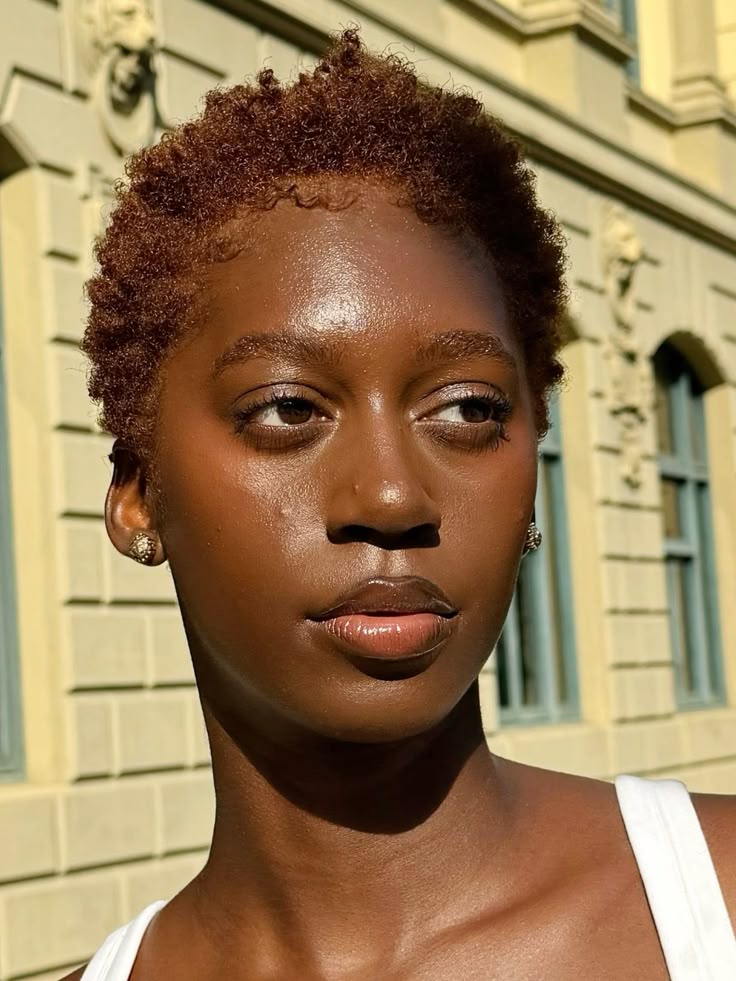 Black woman with freshly colored 4C natural hair